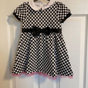 Beautiful dress with pink tulle on the bottom.